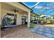 Inviting patio with comfortable seating, shade, and access to the pool area at 5457 Sandy Shell Dr, Apollo Beach, FL 33572