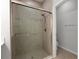 Bathroom showing the modern shower with glass door and the tiled walls at 6211 114Th E Dr, Parrish, FL 34219