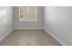 Cozy bedroom with a window, tile flooring and freshly painted walls at 6211 114Th E Dr, Parrish, FL 34219