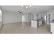 Open floor plan showcasing kitchen with stainless appliances and an island with granite countertop at 6211 114Th E Dr, Parrish, FL 34219