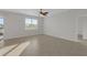 A spacious, light-filled living room featuring tile flooring and access to the outdoors at 6211 114Th E Dr, Parrish, FL 34219