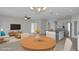 Inviting open-concept living space combining the living room, dining area, and kitchen for modern living at 6211 114Th E Dr, Parrish, FL 34219