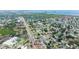 Wide aerial shot reveals the residential neighborhood of the property and surrounding landscape at 6304 Memorial Hwy, Tampa, FL 33615