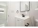 Modern bathroom featuring a new vanity with matte black fixtures and updated lighting at 6304 Memorial Hwy, Tampa, FL 33615