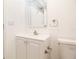 Bright bathroom featuring a white vanity with updated faucet, framed mirror, and neutral fixtures at 6304 Memorial Hwy, Tampa, FL 33615