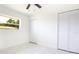 Bedroom featuring marble flooring, a window, and bi-fold closet doors at 6304 Memorial Hwy, Tampa, FL 33615