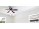 Well lit bedroom featuring a ceiling fan and two windows at 6304 Memorial Hwy, Tampa, FL 33615