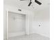 Bedroom closet with an open bi-fold door showing shelving and neutral walls at 6304 Memorial Hwy, Tampa, FL 33615