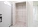 Entryway with a closet featuring adjustable wire shelving, adding functionality at 6304 Memorial Hwy, Tampa, FL 33615