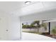 Attached garage featuring white walls and door with an open view to the driveway at 6304 Memorial Hwy, Tampa, FL 33615