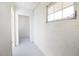 Bright hallway with white walls, trim, and window, offering a clean and airy feel at 6304 Memorial Hwy, Tampa, FL 33615