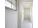 Clean hallway featuring block walls and a window for natural light at 6304 Memorial Hwy, Tampa, FL 33615
