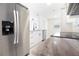 Modern kitchen featuring stainless steel appliances, granite countertops, and updated cabinetry at 6304 Memorial Hwy, Tampa, FL 33615