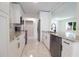 Open-concept kitchen features stainless steel appliances, granite counters, and ample storage at 6304 Memorial Hwy, Tampa, FL 33615