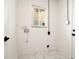 Clean, white laundry room with a window for natural light at 6304 Memorial Hwy, Tampa, FL 33615