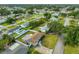 Aerial view of single-story home with fenced yard and nearby community pool at 6401 15Th N St, St Petersburg, FL 33702