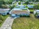 Aerial view of single-story home with fenced yard, well-maintained lawn, and convenient driveway at 6401 15Th N St, St Petersburg, FL 33702