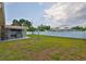Large backyard with a privacy fence, well-maintained lawn, and a patio area, perfect for outdoor enjoyment at 6401 15Th N St, St Petersburg, FL 33702