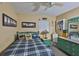Inviting bedroom featuring a ceiling fan, natural light from the windows, and pleasing decor at 6401 15Th N St, St Petersburg, FL 33702