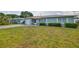 Single-story home boasts tidy landscaping, attached one-car garage, and a well-maintained lawn at 6401 15Th N St, St Petersburg, FL 33702