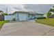 Charming single-story home with a one-car garage, well-maintained lawn, and tidy landscaping at 6401 15Th N St, St Petersburg, FL 33702