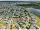 Scenic aerial view showcasing a community's layout, landscaping, and nearby amenities at 6512 Trent Creek Dr, Sun City Center, FL 33573