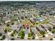 Aerial view of neighborhood showing home with solar panels on a manicured lot near a cul-de-sac at 6512 Trent Creek Dr, Sun City Center, FL 33573