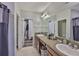 Bathroom featuring double sinks, vanity with granite counters, and ample storage space at 6512 Trent Creek Dr, Sun City Center, FL 33573