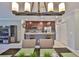 Dining area showcasing a modern chandelier and views of the kitchen with breakfast bar at 6512 Trent Creek Dr, Sun City Center, FL 33573
