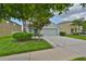 Charming single-Gathering home with a well-maintained lawn and a two-car garage at 6512 Trent Creek Dr, Sun City Center, FL 33573