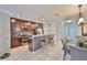 Well-equipped kitchen featuring stainless steel appliances, granite counters and breakfast bar seating at 6512 Trent Creek Dr, Sun City Center, FL 33573