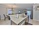 Open kitchen with granite countertops, stainless steel appliances, and a breakfast bar at 6512 Trent Creek Dr, Sun City Center, FL 33573