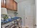 Well-lit laundry room equipped with a modern washer and dryer set at 6512 Trent Creek Dr, Sun City Center, FL 33573
