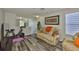 Cozy upstairs living room area with a sofa and exercise equipment at 6512 Trent Creek Dr, Sun City Center, FL 33573