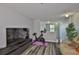 Cozy upstairs living room area with a sofa and exercise equipment at 6512 Trent Creek Dr, Sun City Center, FL 33573