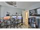 Home office features wood floors, a ceiling fan, and an organized workspace at 6512 Trent Creek Dr, Sun City Center, FL 33573