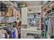 Walk-in closet featuring ample storage shelves and hanging space at 6512 Trent Creek Dr, Sun City Center, FL 33573