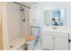 Bright bathroom featuring walk-in shower, white vanity, and medicine cabinet mirror at 7065 73Rd N St, Pinellas Park, FL 33781