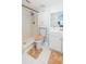 Bright bathroom featuring walk-in shower, white vanity, and medicine cabinet mirror at 7065 73Rd N St, Pinellas Park, FL 33781