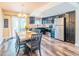 Bright dining area and kitchen with stainless appliances, modern cabinetry, and stylish flooring, perfect for Gathering meals at 7065 73Rd N St, Pinellas Park, FL 33781