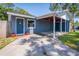 Charming single-story home with a covered parking area and blue exterior paint at 7065 73Rd N St, Pinellas Park, FL 33781