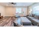 Inviting living room with wood floors, large windows, and comfortable furnishings at 7065 73Rd N St, Pinellas Park, FL 33781