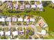 Aerial view of a property with lush greenery, waterfront access, and a suburban neighborhood at 7313 Royal Palm Dr, New Port Richey, FL 34652