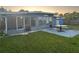 Inviting backyard with a table, chairs, dog, and a view of the water at 7313 Royal Palm Dr, New Port Richey, FL 34652