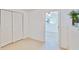 Spacious room with dual closets and seamless doorway to a bedroom at 7313 Royal Palm Dr, New Port Richey, FL 34652