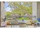 Inviting balcony with a table and chairs, perfect for enjoying views of the lush landscaping at 741 Mainsail Dr, Tampa, FL 33602
