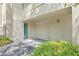 Garage and entryway of home, surrounded by lush landscaping and bright natural light at 741 Mainsail Dr, Tampa, FL 33602