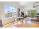 Inviting living space with a large window, a dining table, and balcony access, filled with natural light at 741 Mainsail Dr, Tampa, FL 33602