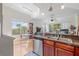 Open floor plan featuring a modern kitchen with stainless steel appliances connecting to the living and dining area at 741 Mainsail Dr, Tampa, FL 33602