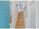 Bright stairway with wooden steps and built-in bookshelves, adding charm to the home at 741 Mainsail Dr, Tampa, FL 33602